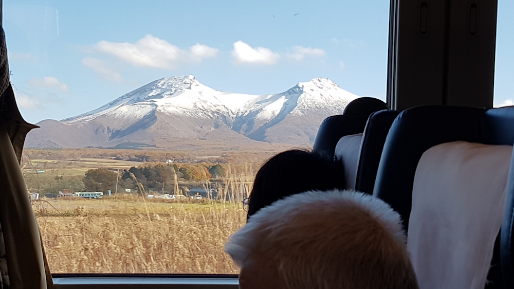 Volcano Komagatake seen from Super Hokuto Limited Express